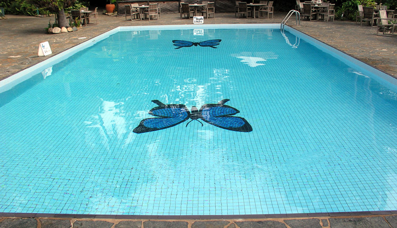 Tables by the pool.